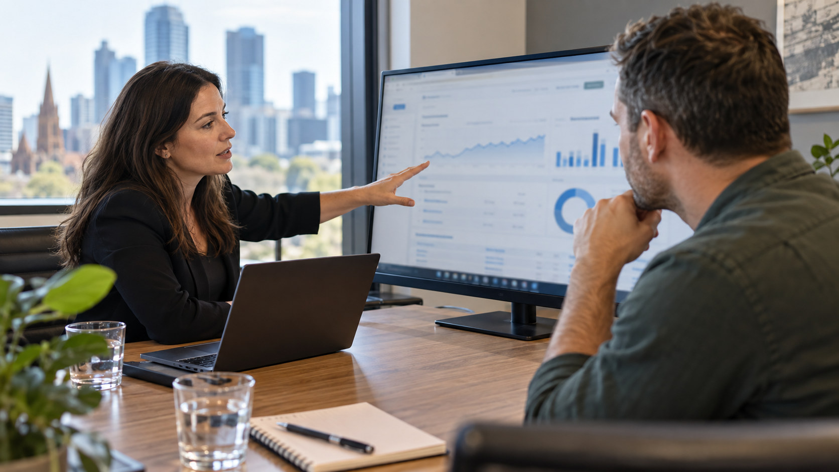 SEO adviser and business owner review website visibility reporting.