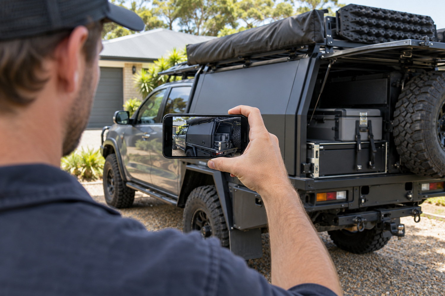 Owner photographs a touring ute and its canopy with a smartphone for a build enquiry.